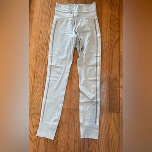 Vuori xs light grey leggings with grey and white detail on sides